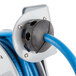 A close up of a T&S hose reel with blue and black wires.