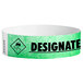 A mint green Carnival King Tyvek wristband with black text that reads "DESIGNATED DRIVER"