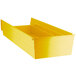 A yellow plastic Regency shelf bin with a lid.
