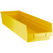 A yellow Regency plastic shelf bin with two compartments.