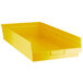 A yellow plastic shelf bin.