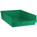 A green Regency plastic shelf bin.