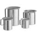 A group of silver aluminum Choice measuring cups with pour lips and handles.