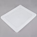 A Vollrath stainless steel flexible steam table pan lid on a white plastic tray.
