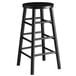 A Lancaster Table & Seating black metal bar stool with a round seat.