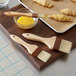 A tray of croissants with 3 Boar Bristle pastry brushes with wood handles.