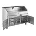 A stainless steel Regency portable bar with two metal speed rails.