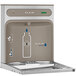 An Elkay stainless steel water fountain with a bottle filling station on the front.