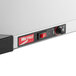 A Metro Super Erecta stainless steel countertop shelf warmer.