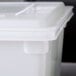 A white Rubbermaid polyethylene lid on a white plastic container.