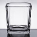 A clear square glass with a square edge.