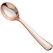 A close-up of a rose gold plastic soup spoon with a handle.