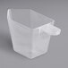 A 4 oz. clear plastic Polypropylene measuring cup with a handle.
