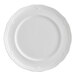 A white porcelain plate with a scalloped wide rim.