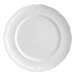 A white porcelain plate with a scalloped wide rim.