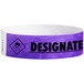 A purple Tyvek wristband with the word "DESIGNATED DRIVER" in black text.