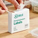 A box of Noble 1" x 2" blank dissolving product labels with a dispenser carton containing 500 labels per roll.