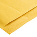 A close up of a yellow Lavex Self-Sealing Kraft bubble mailer with a folded flap.
