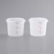 Two translucent plastic Choice food storage containers with lids.