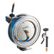A Regency stainless steel hose reel with a hose attached.