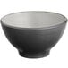 A matte grey and black melamine bowl with a white rim.