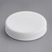A 53/400 white plastic cap on a gray surface.