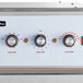 The control panel of a Cooking Performance Group SlowPro cook and hold oven with three knobs and a dial.