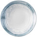 A white bowl with a blue and gray circular pattern on the rim.