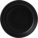 A black stoneware olive/tapas dish with a black circle inside a white circle.