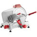 A silver Berkel meat slicer with red handles.
