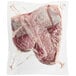 Rastelli's 36 oz. Wet-Aged Black Angus Bone-In Porterhouse Steak wrapped in plastic.