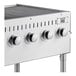 A Backyard Pro stainless steel outdoor grill with four burners and knobs.