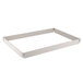 A white rectangular fiberglass sheet pan extender with metal corners.