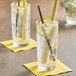 Two glasses of Tractor Beverage Co. Organic Lemongrass soda with straws and lemon slices.