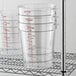 A stack of Cambro clear plastic food storage containers.