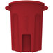 A red Toter commercial trash can with a lid.