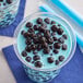 A blue cup of bubble tea with black Fanale Tapioca Boba Pearls.