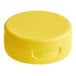 A close-up of a yellow 38/400 plastic flip top lid with a pressure sensitive liner.
