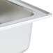 A Vollrath stainless steel water pan with a drain.