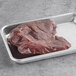 A Shaffer Venison Farms boneless leg medallion venison steak in a metal tray.