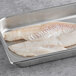 Two Wulf's Wild Caught Icelandic Cod fillets in a metal tray.