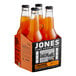 A cardboard case of 24 Jones Orange Soda glass bottles.
