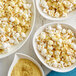 A bowl of popcorn topped with Large Flake Fortified Nutritional Yeast.
