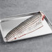 Wulf's Wild Caught Striped Bass Fillet on a metal tray.