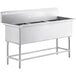 A Regency stainless steel three compartment sink on a counter.
