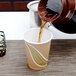 A coffee being poured into an Eco-Products paper cup.