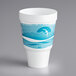 A white Dart foam cup with a blue and white wave design.