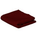 A folded burgundy Intedge rectangular cloth table cover.