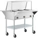 A ServIt stainless steel electric steam table on wheels with a clear cover.
