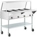A ServIt open well stainless steel electric steam table on wheels.